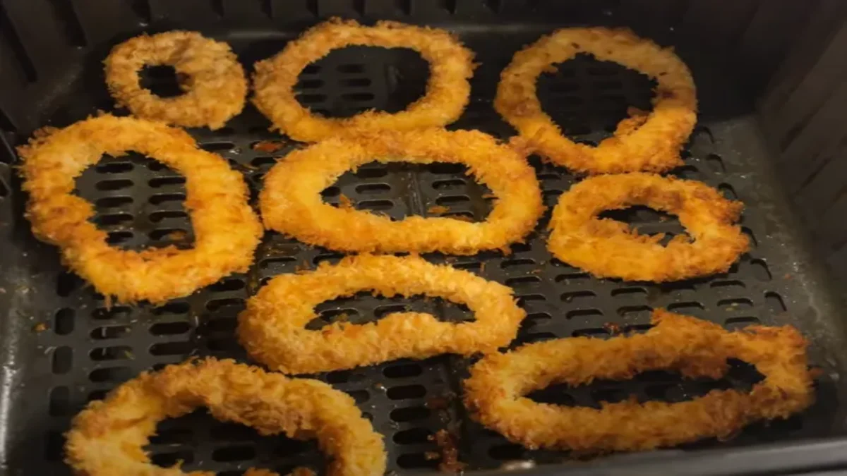 Air Fryer Calamari Crispy air fryer calamari rings with a golden coating, served with lemon wedges and dipping sauce for a light and flavorful appetizer.