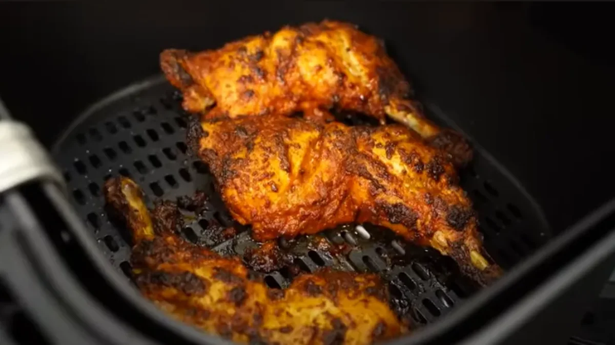 Chicken Thigh recipe air fryer Juicy air fryer thighs with crispy, golden-brown skin, seasoned to perfection and served with herbs or sides